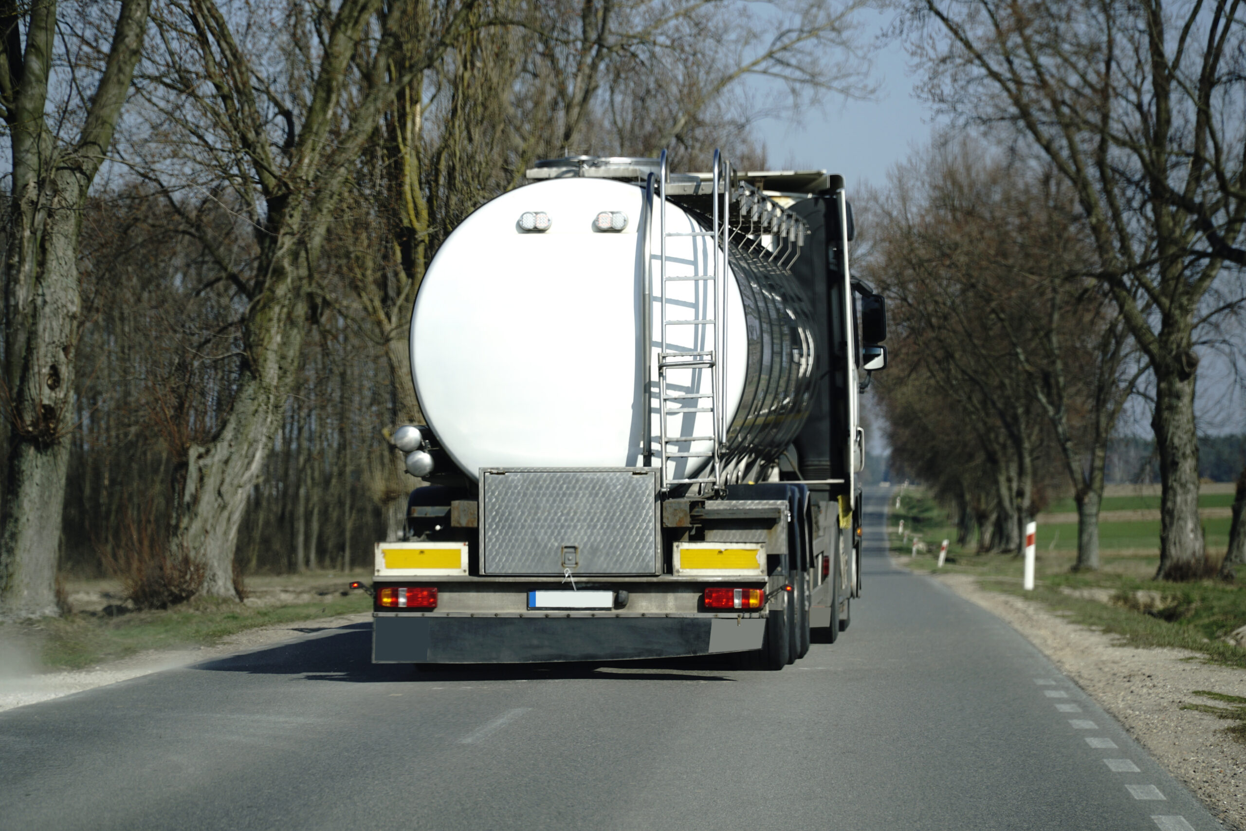 Tank car on a road - back view
